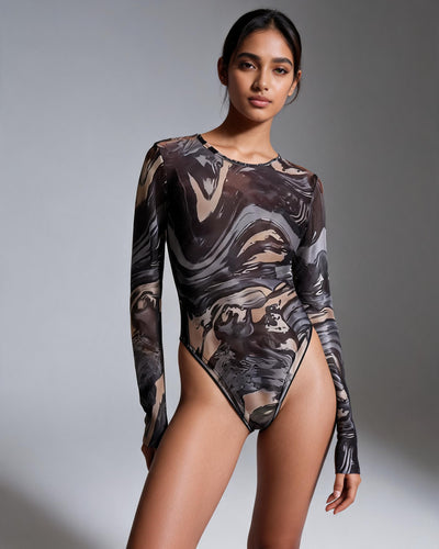 Printed mesh tulle bodysuit worn by model with long sleeves in a brown, beige, and black abstract print