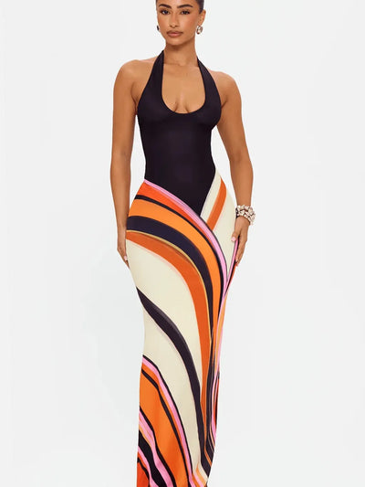 Sunset Wave Maxi Dress by Exclusives, halter-neck black top with a bold multicolor abstract wave skirt, maxi length.