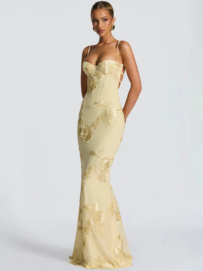 Pale yellow floral jacquard mermaid maxi dress with a boned corset bodice, slim spaghetti straps, and all-over gold floral embroidery.