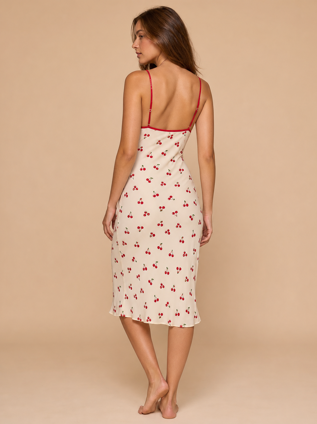 Scarlet Cherry Slip Midi Dress; cream fabric with red cherry print and red spaghetti straps.