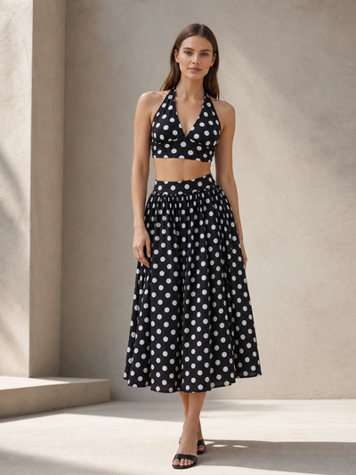 Retro polka-dot halter top and midi skirt set, a two-piece black outfit with white polka dots, perfect for summer wear.