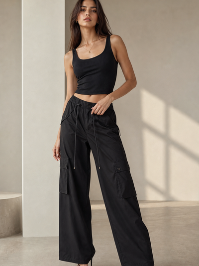 Wide Leg Cargo Pants by Exclusives in black with drawstring waist and cargo pockets.