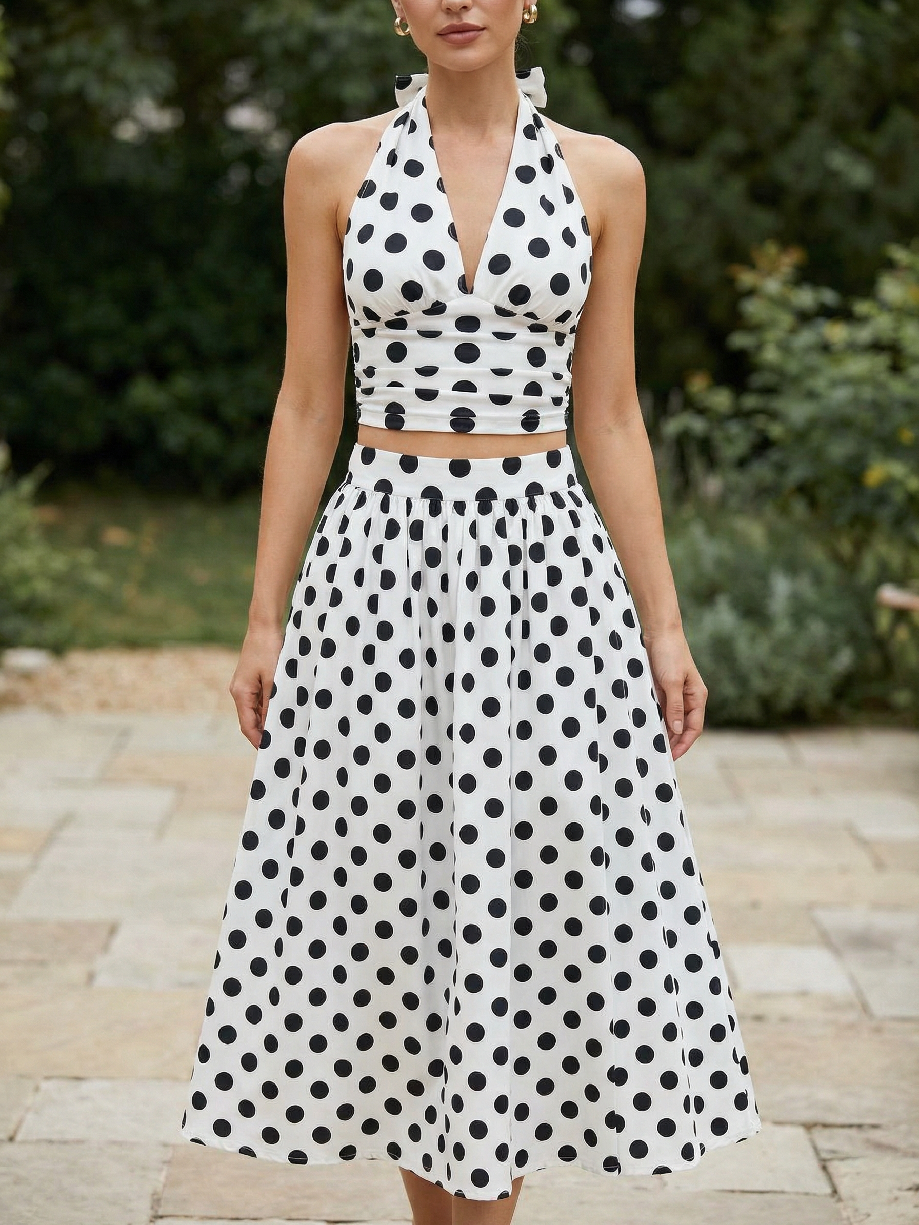 Retro polka-dot halter top and midi skirt set in white with black spots; two-piece outfit on sale