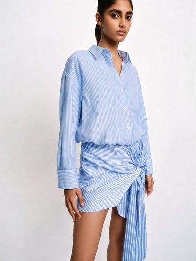 City Stripe Twist Shirt Dress by Exclusives; light blue striped shirt dress with twist wrap detail.