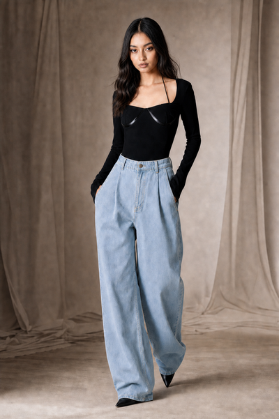 Cropped Halter Long Sleeve Bodysuit in black, paired with light-wash denim wide-leg jeans.