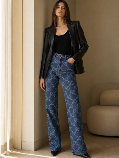 Denim Printed Wide Leg Pants in blue denim with an allover logo pattern by Exclusives