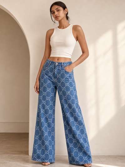 Denim Printed Wide-Leg Pants by Exclusives; blue denim with white monogram pattern.