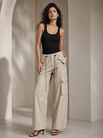 Wide Leg Cargo Pants by Exclusives in beige with drawstring waist and utility pockets.