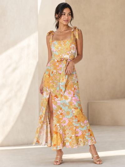 Tied Spaghetti Strap Floral Print Midi Dress by SR Store; yellow pastel floral print, midi length, on sale.