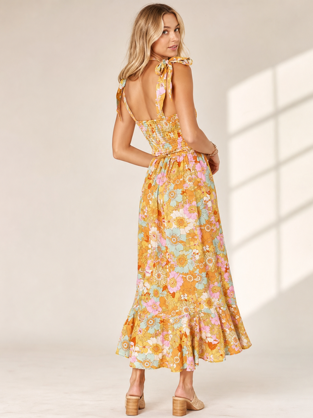 Tied Spaghetti Strap Floral Print Midi Dress in yellow pastel florals with back smocked bodice and tied straps.