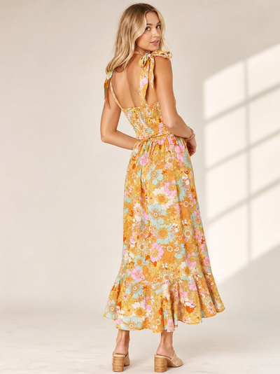 Tied Spaghetti Strap Floral Print Midi Dress in yellow pastel florals with back smocked bodice and tied straps.