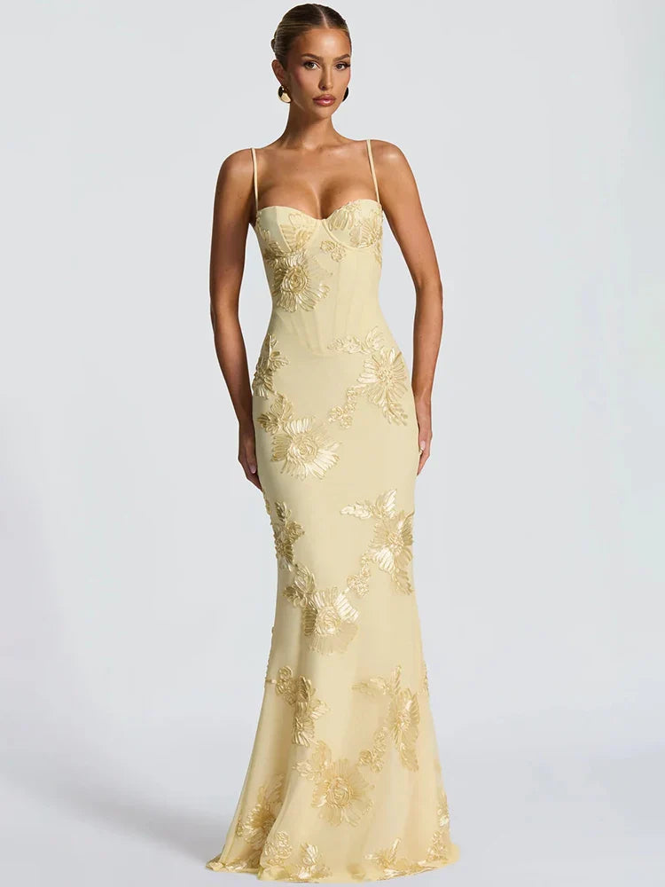 Creamy yellow mermaid maxi dress with gold floral jacquard embroidery, corset sweetheart bodice and thin straps.