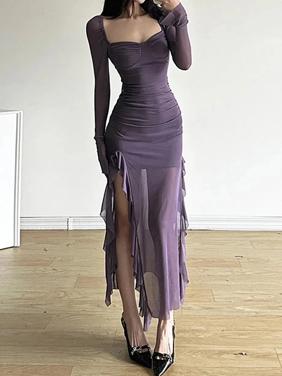 Purple ruched sweetheart-neck maxi dress with sheer long sleeves and layered asymmetrical ruffle hem.