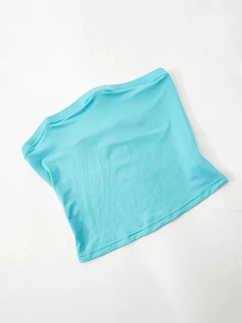 Aqua blue draped cape mini dress laid flat on white background, showing a loose cape overlay over a simple bodice.