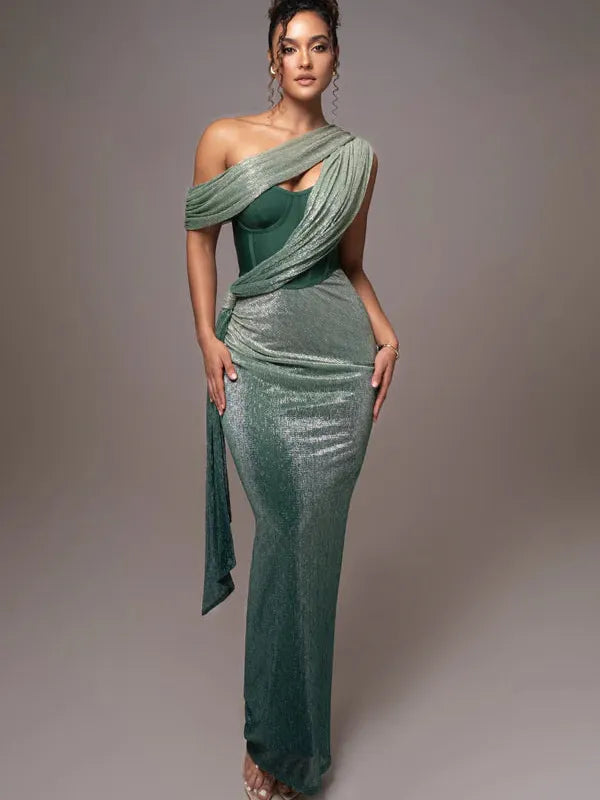 Shimmery green floor-length gown with a corset bodice, extra fabric draped over one shoulder for an asymmetric neckline.
