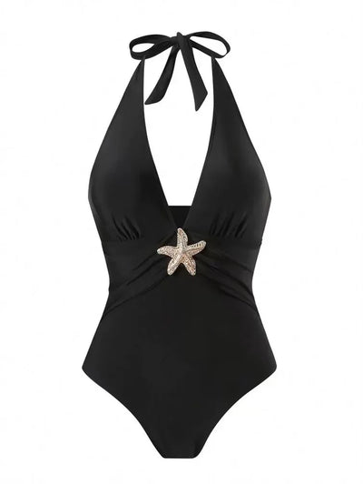 Black halter-neck one-piece swimsuit with plunging neckline and twisted waist, starfish ornament at center.