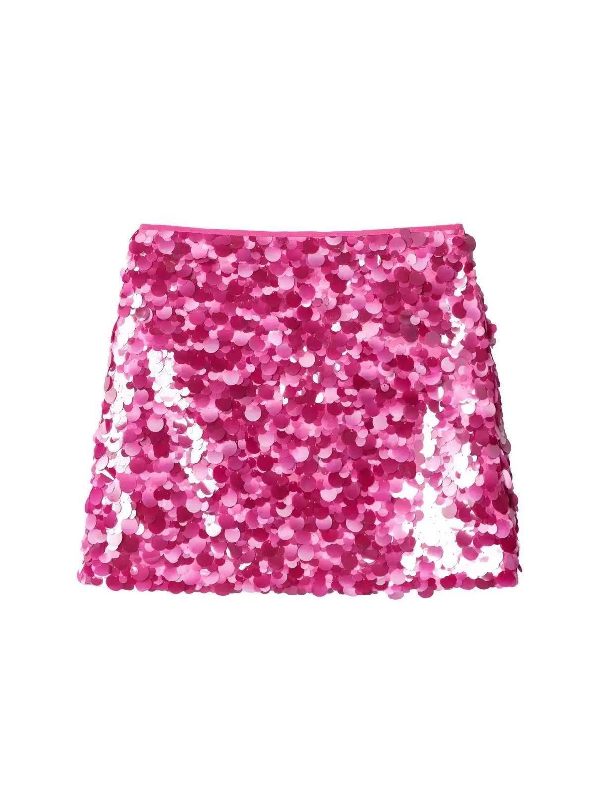 Vibrant pink sequined mini skirt densely covered with round coin-shaped sequins.