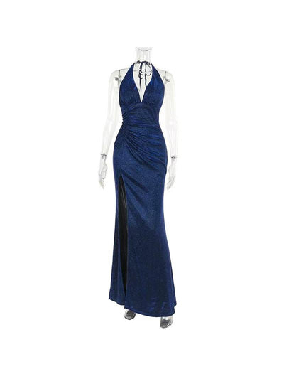 Navy blue shimmering backless halter-neck maxi dress with gathered side ruching and a high slit.