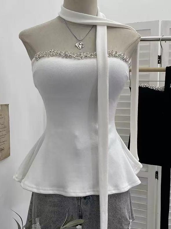 Crystal Trim Halter Peplum Top, white, on display; black crystal-trim top visible on rack (2 tops shown)