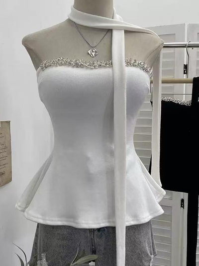 Crystal Trim Halter Peplum Top, white, on display; black crystal-trim top visible on rack (2 tops shown)