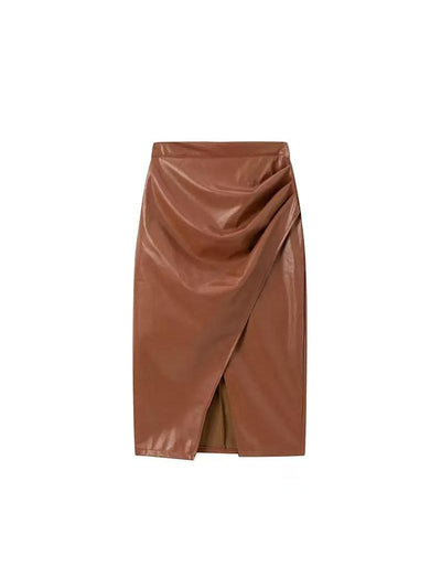 Cognac faux leather wrap midi skirt with a draped front panel and angled front slit.