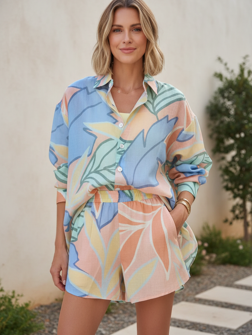 Tropical pastel oversized shirt and matching shorts co-ord set in blue, peach, mint print.