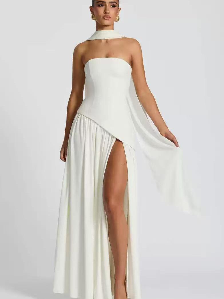 Ivory satin strapless tube maxi dress with an asymmetric draped overlay, thigh-high slit, and a matching neck scarf.
