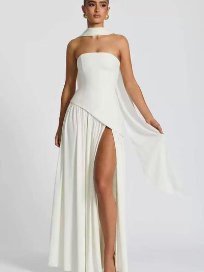 Ivory satin strapless tube maxi dress with an asymmetric draped overlay, thigh-high slit, and a matching neck scarf.