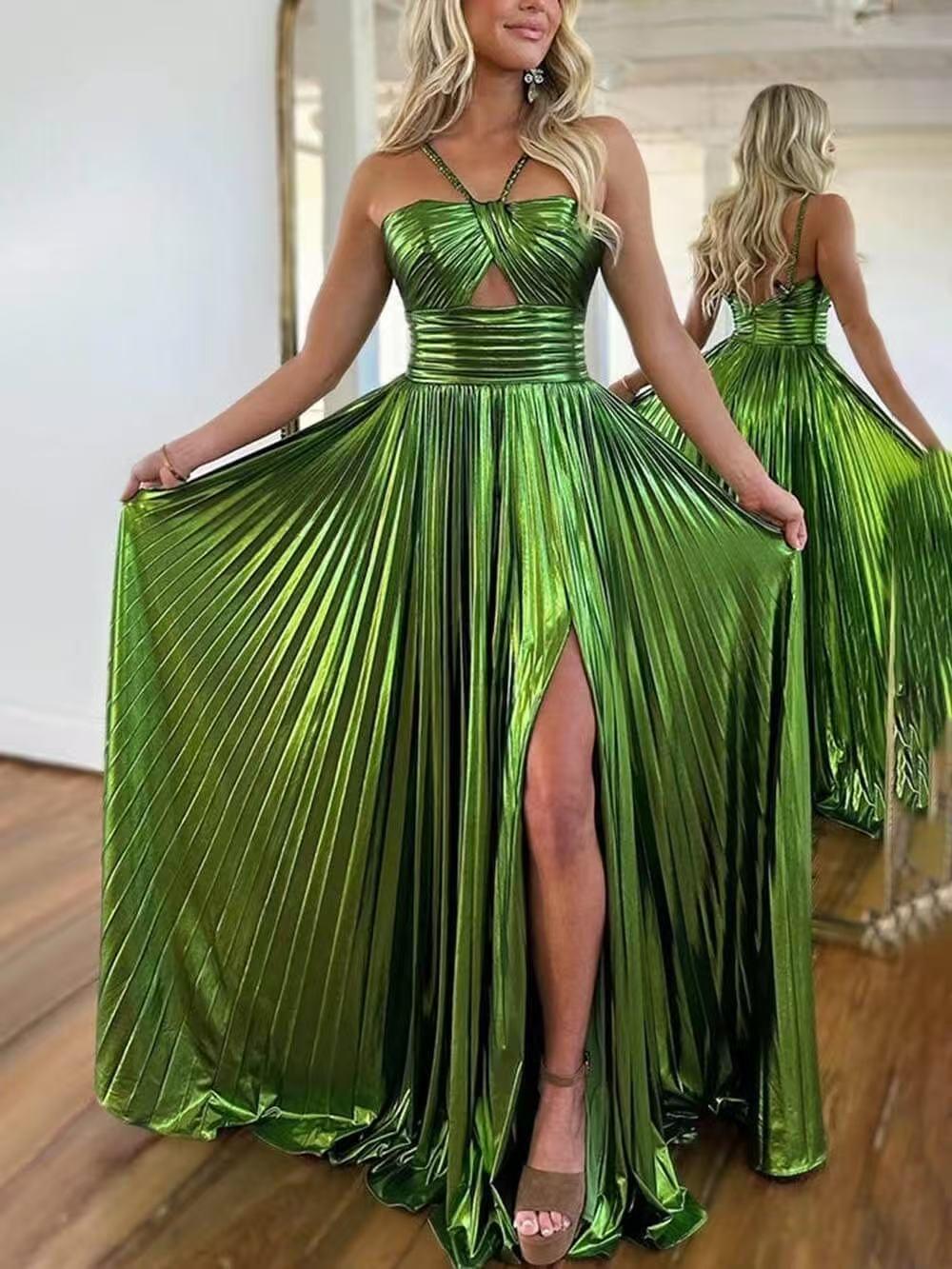 Emerald green metallic pleated halter-neck maxi dress with a front cutout and a high slit, flowing pleated skirt