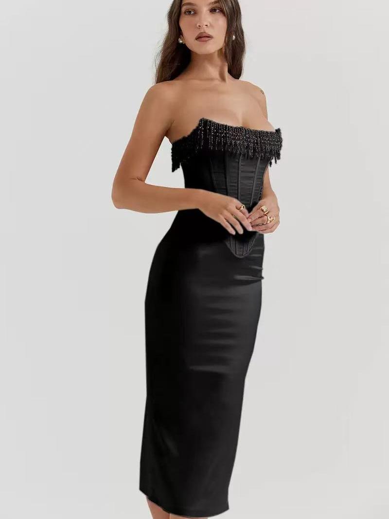 Black strapless corset midi dress with pearl beaded fringe along the neckline; satin finish, fitted waist, mid-calf.