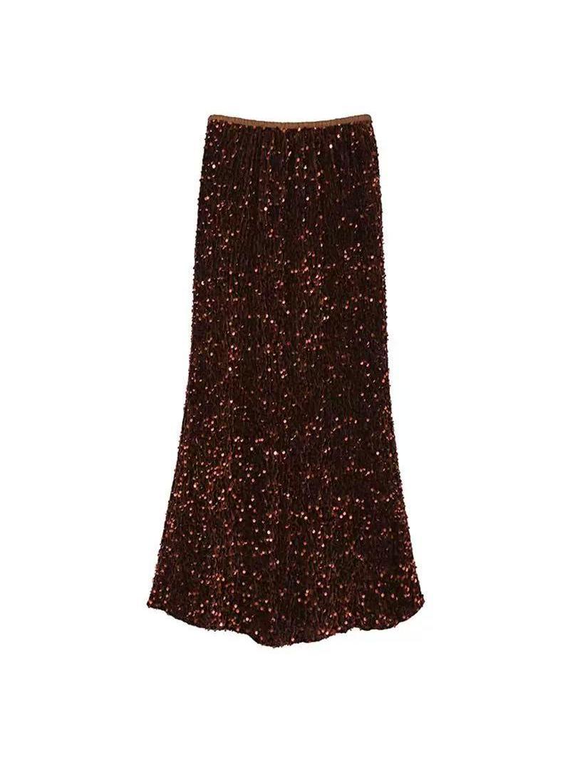 Dark burgundy sequin maxi skirt densely covered in shimmering sequins, floor-length with a subtle flare.