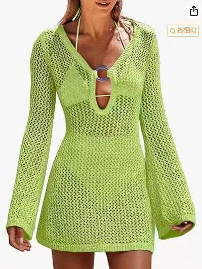 Lime green crochet beach cover-up dress with long sleeves and a keyhole opening secured by a circular ring.