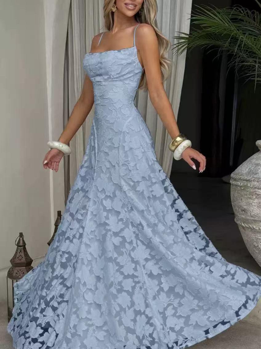 Light blue floral appliqué cowl-neck A-line maxi dress on a model with spaghetti straps, flowing lace skirt.