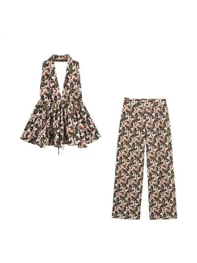 Beige boho leaf-print halter top with peplum and matching wide-leg pants set in brown, green, black foliage.