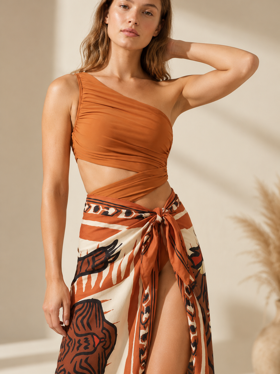 One-Shoulder Swimsuit & Tiger Sarong Skirt Set, burnt orange with tiger print, two-piece combo.