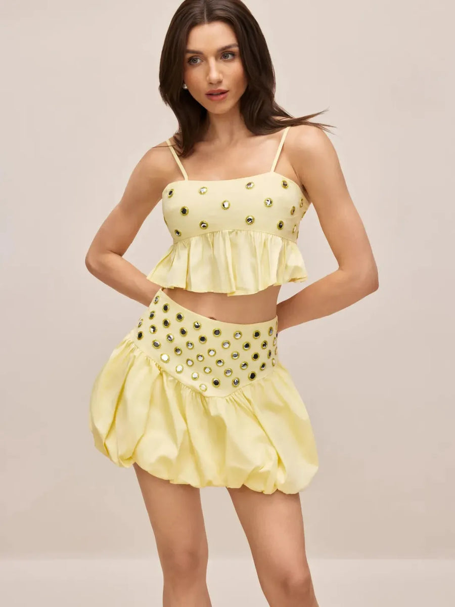 Eyelet Embellished Ruffle Co‑Ord Set by Exclusives in pale yellow; two-piece with cropped top and bubble skirt