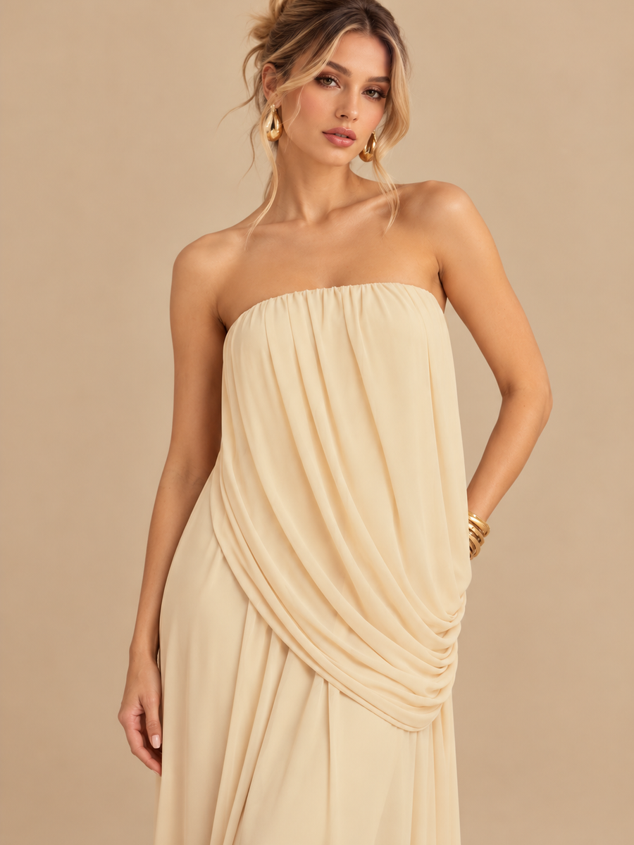 Ivory strapless draped maxi dress with gathered bodice and flowing fabric.
