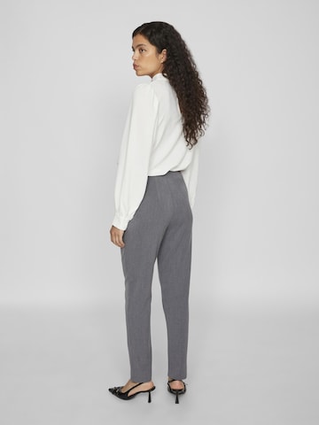 Gray high-waist ankle-length pants on model, on sale