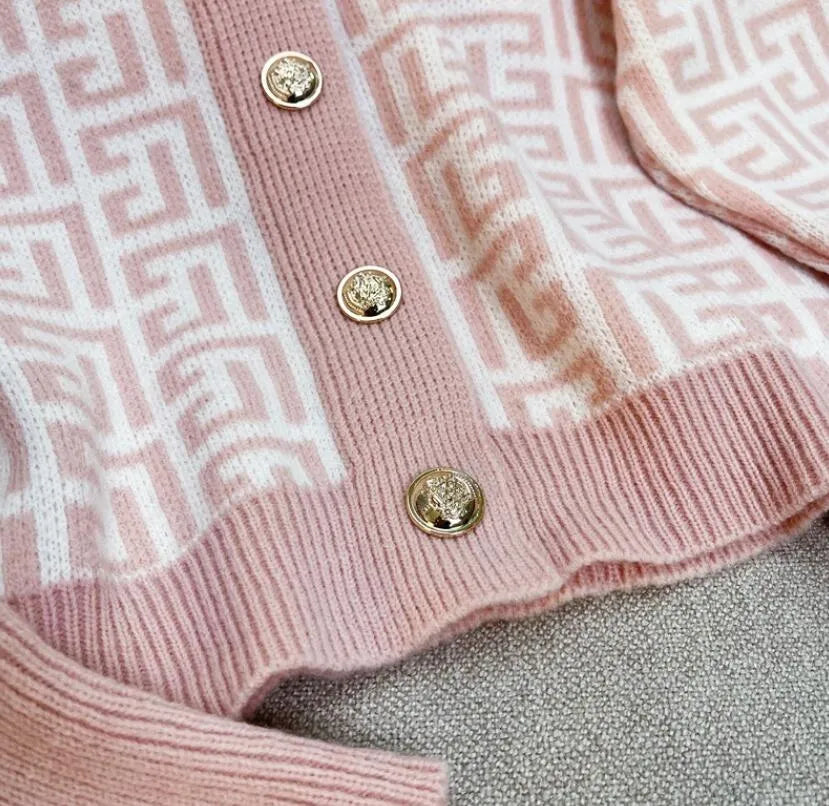Print Fifi Button Knit Top by SR Store, pink knit blouse with gold-tone buttons and geometric white pattern.