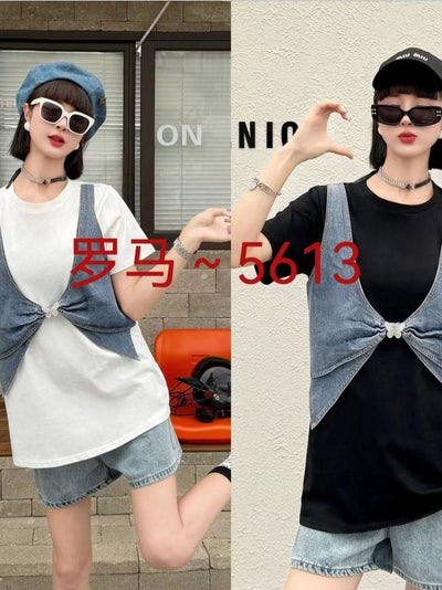 Two models in oversized blue denim waistcoats knotted at the front over white and black tees with denim shorts.