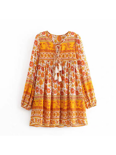 Floral printed flare short dress by SR Store in orange and yellow with tassel-tie neckline and long sleeves