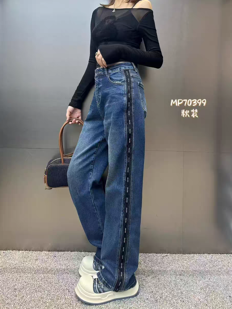 Blue wide-leg denim pants with side stripe tape detail.