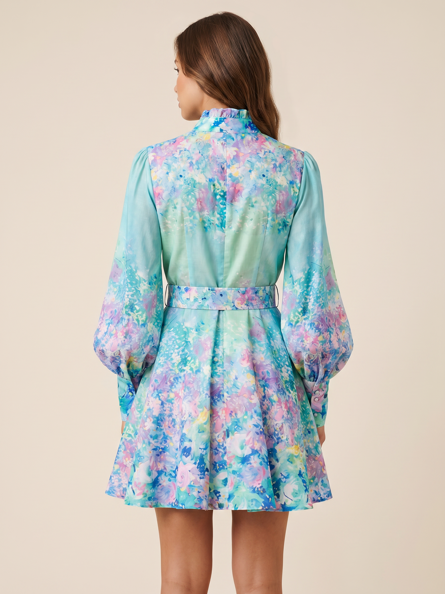 Green floral print A-line dress with belt, back view; pastel blue-green hues and purple accents