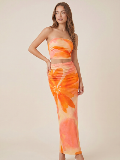 Exclusives two-piece flower-printed tube top and skirt coord set in orange peach tones