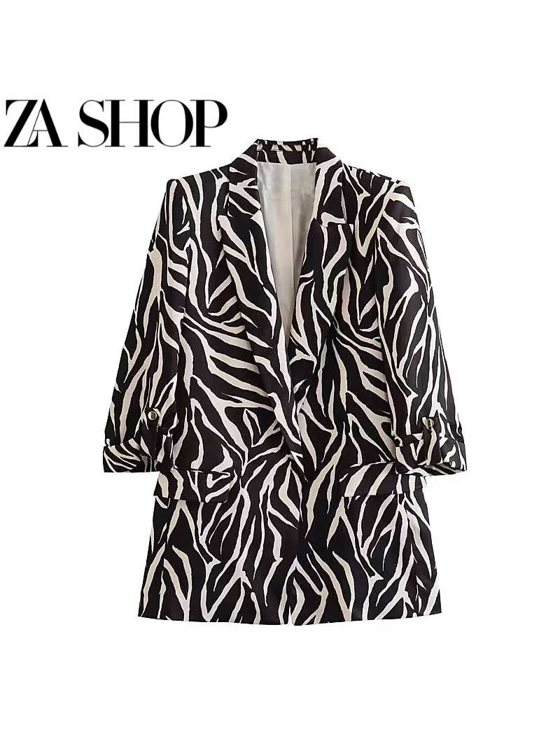 Zebra-pattern blazer with rolled sleeves, open front, and front flap pockets in black and white.