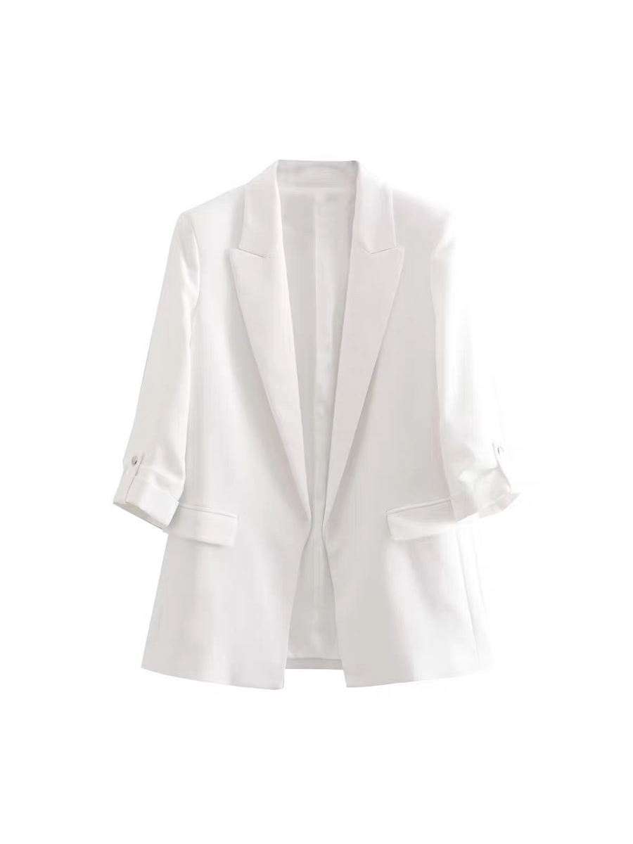 White blazer with notched lapels, open front, rolled sleeves secured by button tabs, and front flap pockets