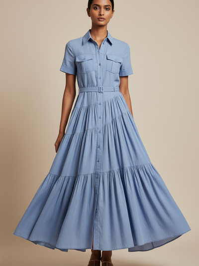 Button Down Collared Maxi Dress by Exclusives in light blue denim, belted waist with tiered, flowing skirt.