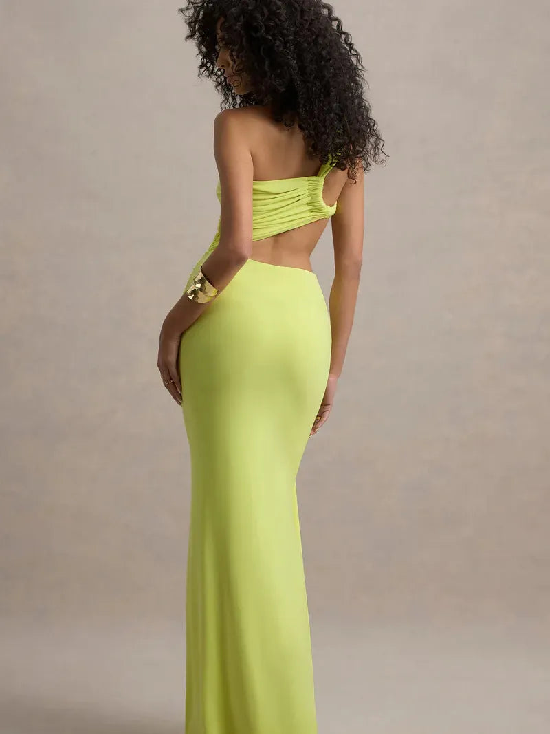 Back view of neon lime-green one-shoulder bodycon maxi dress with ruched bodice and floor-length silhouette.