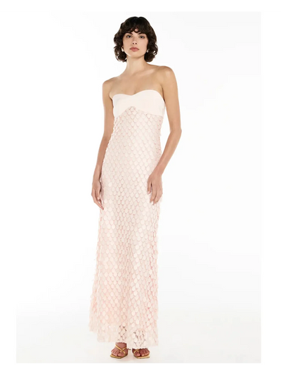 Strapless white sweetheart bustier top with a blush pink mermaid-scale sequin maxi dress, floor-length.