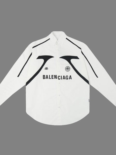White oversized long-sleeve shirt with bold black curved print across chest and BALENCIAGA lettering, black piping along shoulders.